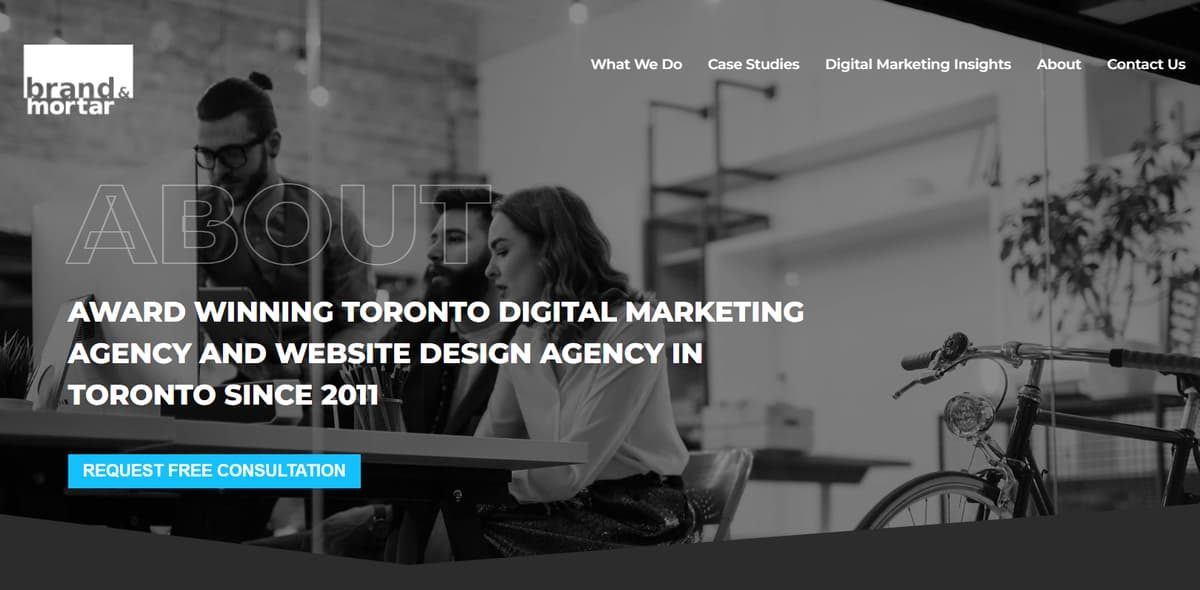 Brand & Mortar Toronto digital marketing agency website banner showing team collaborating in modern office