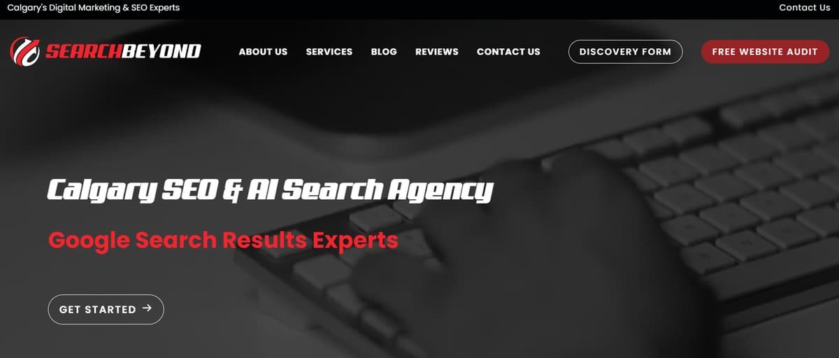 Search Beyond website header displaying Calgary SEO and AI Search Agency over hands typing on a keyboard.
